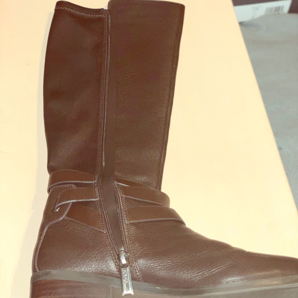 Like new BCBG riding boots. Reg. calf size
